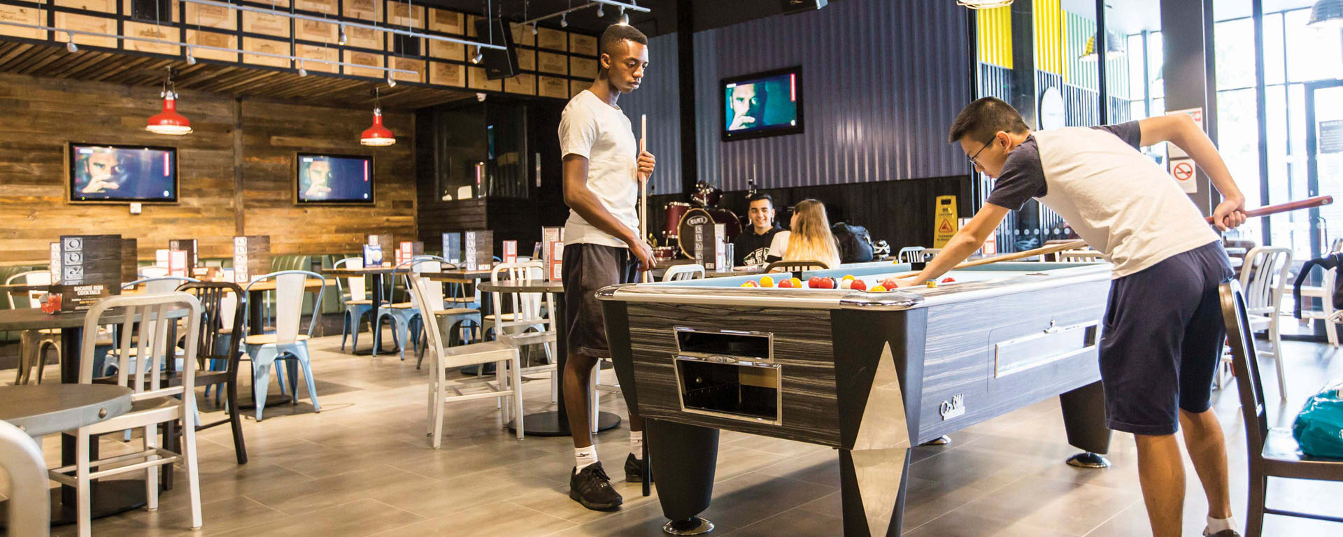 Students playing pool in CARGO, Medway
